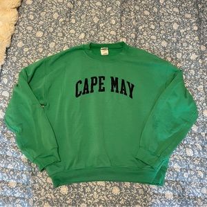 Green & navy embroidered cape may crewneck